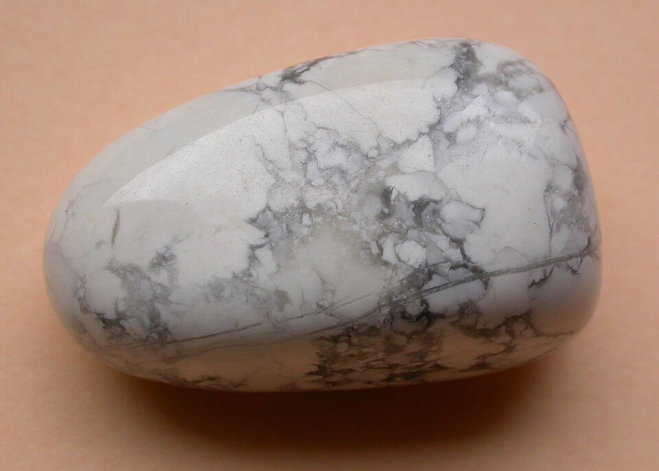 A polished white howlite stone